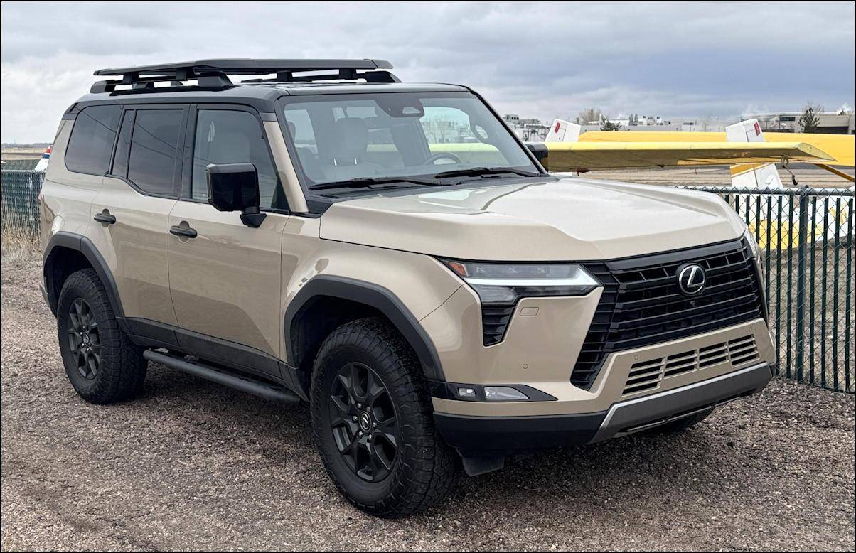 2024 lexus gx550 overtrail+ a luxury suv, photo at local airport with planes in background