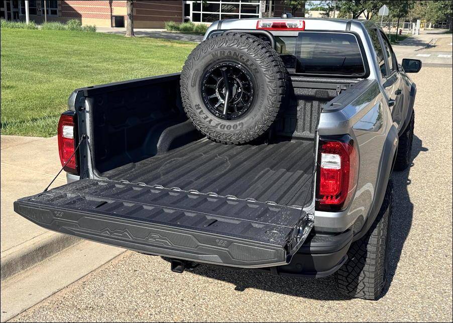 2025 gmc canyon 4wd at4x aev - rear exterior truckbed with spare tire, tailgate down