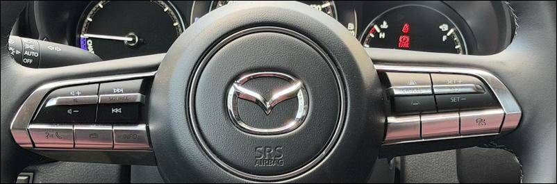 2026 mazda cx50 hybrid steering wheel crossbar buttons controls