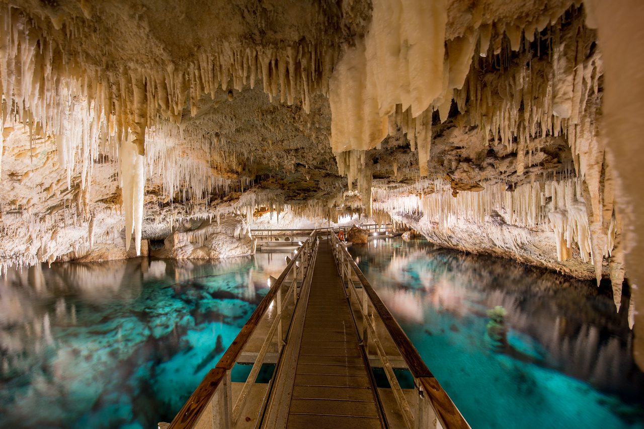 Crystal Cave in Bermuda with stalactites and clear blue underground pool