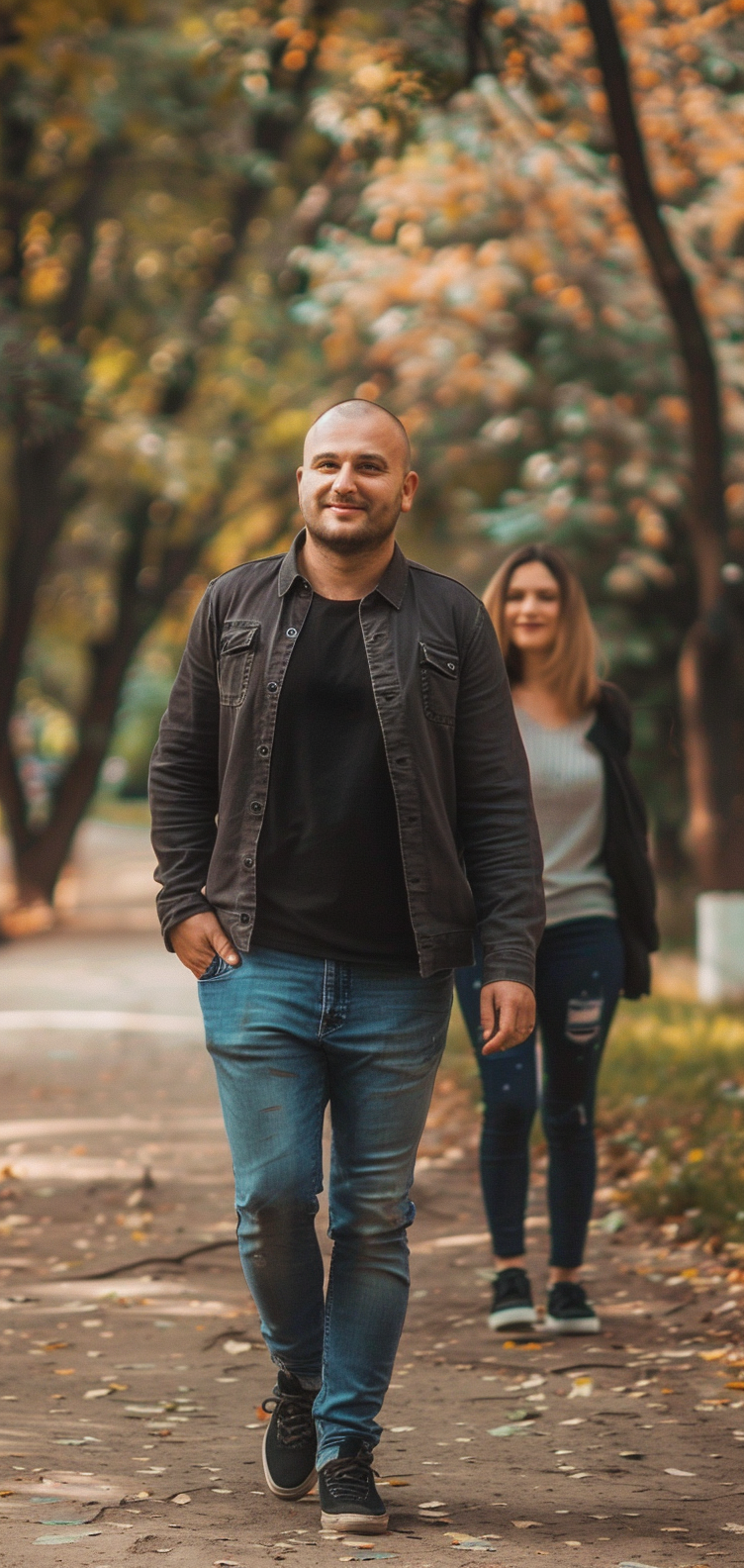 balding man confident walking in park