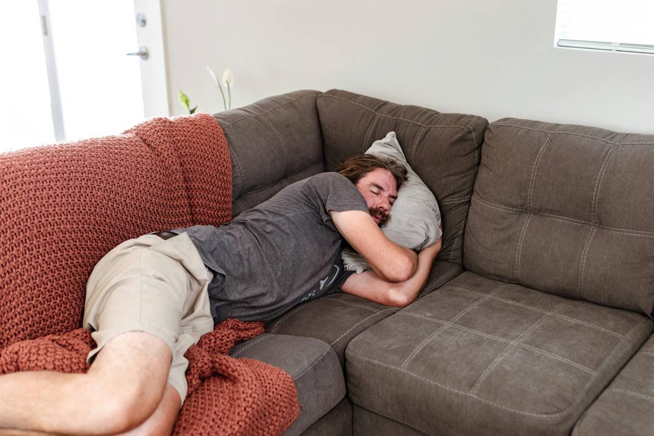 man frustrated by inability to sleep