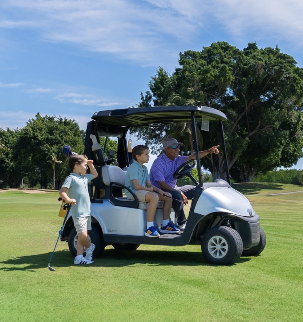 Family riding golf cart at Marina Vallarta Golf Course in Puerto Vallarta