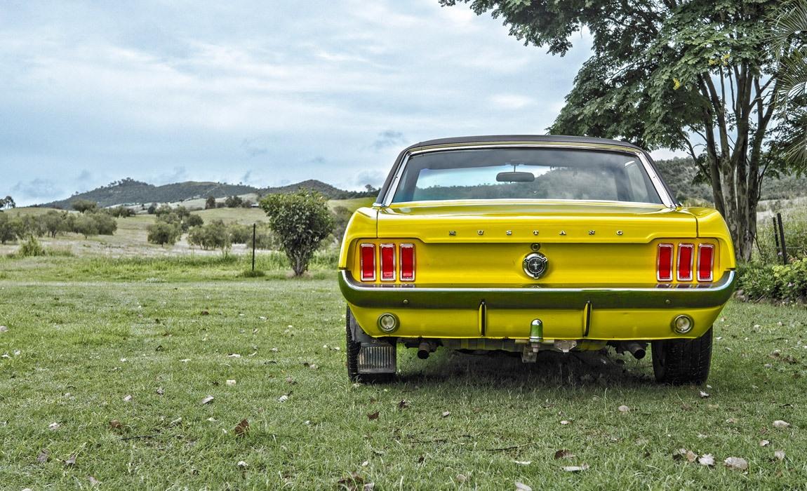 Driving a classic Mustang sports car is a different experience than a modern car