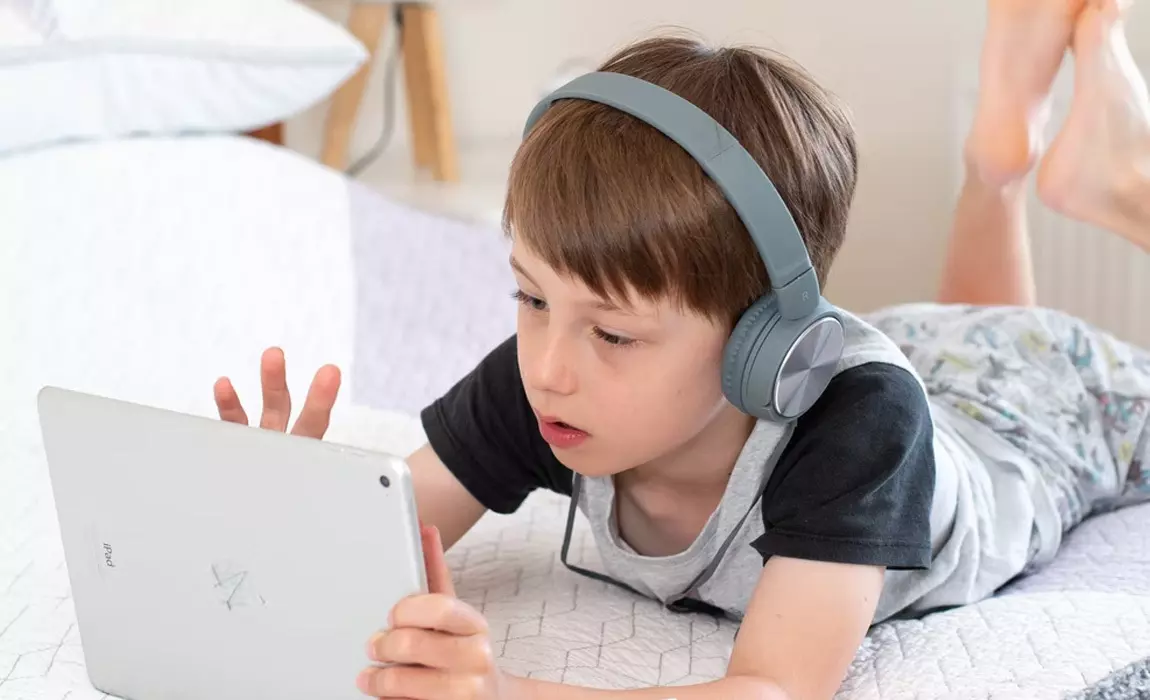 child playing game on tablet