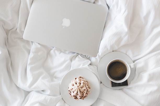 laptop and coffee in bed