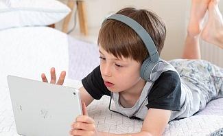 child playing game on tablet