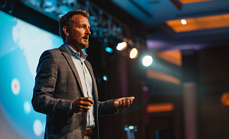 confident man giving presenation at men's health conference