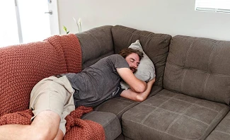 man frustrated by inability to sleep